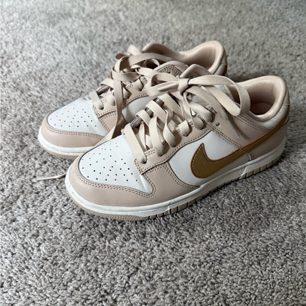 Nike dunks low gold swoosh